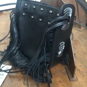Black studded and fringed handbag with inside zipper pocket